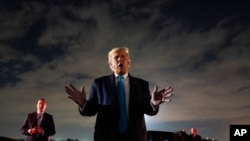 President Donald Trump talks with reporters at Andrews Air Force Base after attending a campaign rally in Latrobe, Pa., Thursday, Sept. 3, 2020, at Andrews Air Force Base, Md. (AP Photo/Evan Vucci)