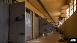 A Syrian man inspects cells at the prison of Saydnaya, north of Damascus, Dec. 16, 2024.