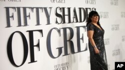 FILE - Author E.L. James poses for photographers at the British premiere of the film “Fifty Shades of Grey” in London, Feb. 12, 2015.