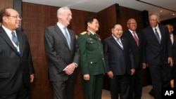 U.S. Defense Secretary Jim Mattis (2nd-L) laughs with Southeast Asian defense ministers after their meeting at the 17th International Institute for Strategic Studies (IISS) Shangri-la Dialogue. (AP Photo/Yong Teck Lim)