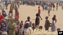 FILE - People who fled their homes due to violence from the militant group Boko Haram are seen inside a refugee camp in Minawao, Cameroon, Feb. 25, 2015.