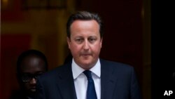 Britain's Prime Minister David Cameron leaves 10 Downing Street in London, to be driven to the Houses of Parliament for a debate and vote on Syria, Aug. 29, 2013. 