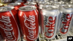 Cans of Coca-Cola and Diet Coke are shown in a cooler in Anne's Deli Thursday, March 17, 2011, in Portland, Ore. 