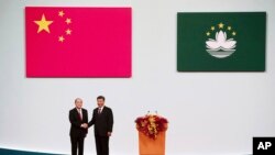 中国国家主席习近平2019年12月会见澳门特首贺一诚（美联社）