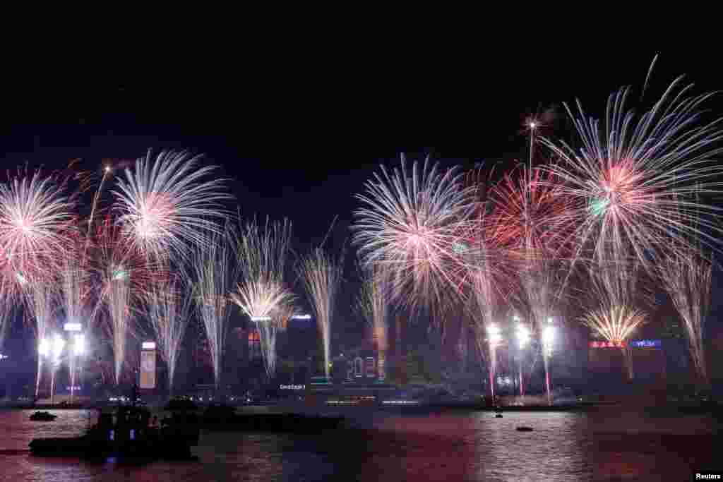 Fireworks explode over Victoria Harbor to celebrate the New Year in Hong Kong, China, Jan. 1, 2025.