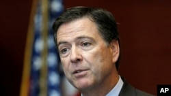 Direktur FBI James Comey berbicara di kantor FBI di Albany, New York (23/9). (AP/Mike Groll)