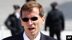 FILE - Lawyer Gregory Katsas speaks outside of the Supreme Court in Washington, March 26, 2012.
