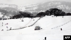 FILE - This picture taken Aug. 1, 2015, shows skiers and snowboarders at Perisher Valley in the Snowy Mountains of southern New South Wales.