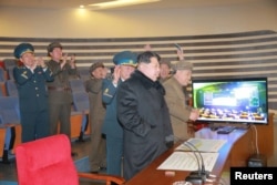 North Korean leader Kim Jong Un reacts as he watches a long range rocket launch in this undated photo released by North Korea's Korean Central News Agency (KCNA) in Pyongyang, Feb. 7, 2016.