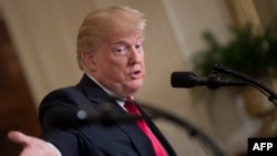 FILE - U.S. President Donald Trump speaks during a press conference at the White House in Washington, Jan. 10, 2018.