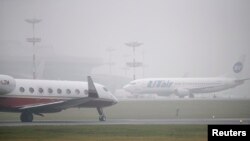 FILE - Planes are seen on the tarmac at Moscow's Vnukovo airport.