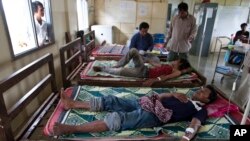 FILE - Patients with malaria areg treated at the hospital in Pailin, Cambodia, Aug. 26, 2009.