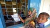 A woman checks for her name on the draft list of the National Register of Citizens in Chandamari village in the northeastern state of Assam, India, January 2, 2018.