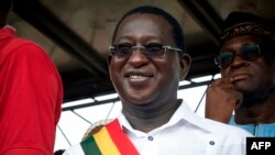 (FILE) In this file photo of August 18, 2018 Malian Opposition leader Soumaila Cisse (C) waves to his supporters during a rally to protest the results of presidential runoff vote in Bamako. He died on December 25, 2020 of COVID-19 in France.