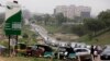 Cars line up to buy fuel at a petrol station in Abuja, Nigeria, April 1, 2016. 