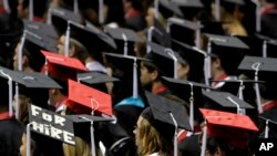 FILE - In this Aug. 6, 2011, picture, students attend graduation ceremonies at the University of Alabama in Tuscaloosa, Ala.