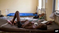 FILE- A child suffering from the Ebola virus receives treatment at Makeni Arab Holding Centre in Makeni, Sierra Leone, Oct. 4, 2014.