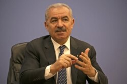 Palestinian Prime Minister Mohammad Shtayyeh addresses journalists during a meeting with members of the Foreign Press Association in Ramallah, in the Israeli-occupied West Bank, June 9, 2020.