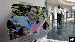 A man walks near a display at a Metlife insurance office in Mumbai, India (File Photo)