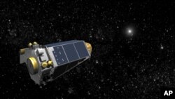 An undated artists concept provided by NASA shows the Keplar Spacecraft moving through space.