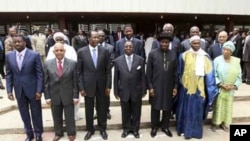 Heads of state and members of the Economic Community Of West African States (ECOWAS) pose for a photograph after attending the 39th ECOWAS Summit in Abuja, March 23, 2011.