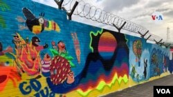 Mural en Guatemala, creado en homenaje a los niños que padecen el impacto de recientes huracanes. [Foto: Eugenia Sagastume, VOA]