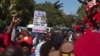 People protest the closure of The Post newspaper in Lusaka, Zambia, June 22, 2016. Zambia's government has closed the country's largest independently owned newspaper over unpaid taxes, but the paper's owner says the move is meant to shut him up before elections in August.
