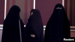 FILE-Veiled Iranian women attend a conservatives campaign gathering in Tehran, Iran, Feb. 24, 2016. 