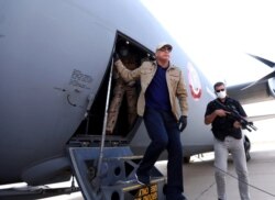 FILE - A handout picture released by Iraq's Prime Minister's Media Office on June 2, 2020, shows Iraqi Prime Minister Mustafa al-Kadhimi, left, arriving in Kirkuk.