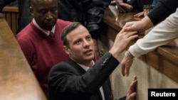 FILE - Olympic and Paralympic track star Oscar Pistorius leaves the court after his sentence hearing at the North Gauteng High Court in Pretoria, South Africa, July 6, 2016. 