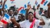 FILE - Supporters of the ruling Rwandan Patriotic Front (RPF) cheer during a rally by Rwandan President Paul Kagame in Nyanza, Rwanda, July 14, 2017.