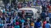 Mourners shout slogans during the funeral procession for slain school principal Supinder Kour, in Srinagar, Indian-administered Kashmir, Oct. 8, 2021.