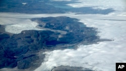 FILE - The Greenland ice sheet is seen in southeastern Greenland, Aug. 3, 2017. 