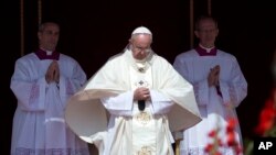 FILE - Pope Francis officiates at a canonization ceremony in St. Peter's Square at the Vatican, May 17, 2015. 
