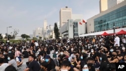 Students and others gather during a demonstration at Edinburgh Place in Hong Kong, Aug. 22, 2019. High school students thronged a square in downtown Hong Kong Thursday to debate political reforms as residents gird for further anti-government protests.