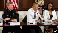 President Obama talks to reporters after a meeting at the Eisenhower Executive Office Building on the White House complex in Washington, July 13, 2016, about community policing and criminal justice.