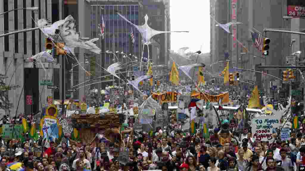 Demonstrators make their way down Sixth Avenue during the People's Climate March, in New York, Sept. 21, 2014.