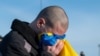 Ukrainian POW reacts after a swap at an unknown location in Ukraine