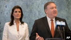 U. S. Secretary of State Mike Pompeo, with U.S. Ambassador to the United Nations Nikki Haley, speaks to reporters at U.N. headquarters, July 20, 2018.
