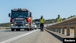 FILE - A handout image shows Department of Fire and Emergency Services crew searching for a radioactive capsule in Australia in this picture obtained on Jan. 28, 2023. 