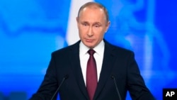 Russian President Vladimir Putin delivers a state-of-the-nation address in Moscow, Russia, Wednesday, Feb. 20, 2019.