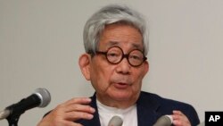 FILE - Nobel laureate Kenzaburo Oe speaks during a press conference about an anti-nuclear petition drive in Tokyo, Sept. 6, 2011.