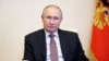 Ruski predsednik Vladimir Putin na ceremoniji potpisivanja generalnog sporazuma ruskih sindikata, 31. marta 2021. (Foto: ARHIVA Sputnik/Alexei Druzhinin/Kremlin via Reuters)
