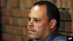 Investigating officer Hilton Botha, sits inside the court witness box during the Oscar Pistorius bail hearing at the magistrate court in Pretoria, South Africa, February 20, 2013.