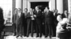 Soviet General Secretary Leonid Brezhnev shakes hands with U.S. President Ford after their first round of talks at the American Embassy in Helsinki, July 30, 1975. (AP Photo)