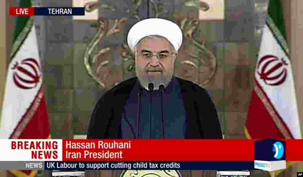 This image taken from video broadcast on Press TV, Iran's English language state-run channel, shows President Hassan Rouhani making a statement hailing 'a new chapter' in relations with the world, following the announcement of the Iran nuclear deal, Tehran, July 14, 2015.