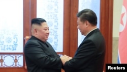 習近平同金正恩握手(資料照片)