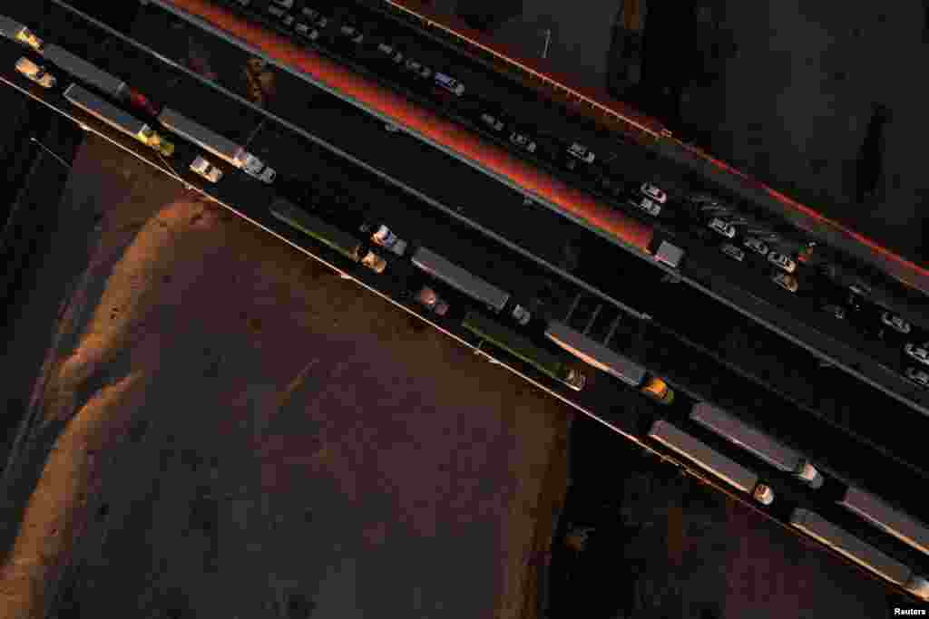 A drone view shows trucks waiting in line at the Zaragoza-Ysleta border crossing bridge to cross into the U.S., in Ciudad Juarez, Mexico, Nov. 26, 2024.