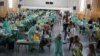 In this Wednesday, Sept. 2, 2020 file photo, teachers and auxiliary staff take COVID-19 tests in Madrid, Spain.
