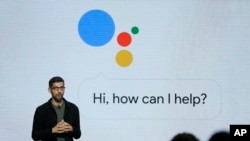 FILE - Google CEO Sundar Pichai is under the "spotlight" as he talks about Google products in San Francisco, Oct. 4, 2016. 